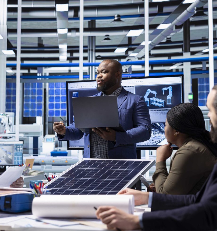 Investor presents sustainable manufacturing solutions to factory executives. Man doing pitch for innovative solar panel production automation technologies to industrial plant management executives